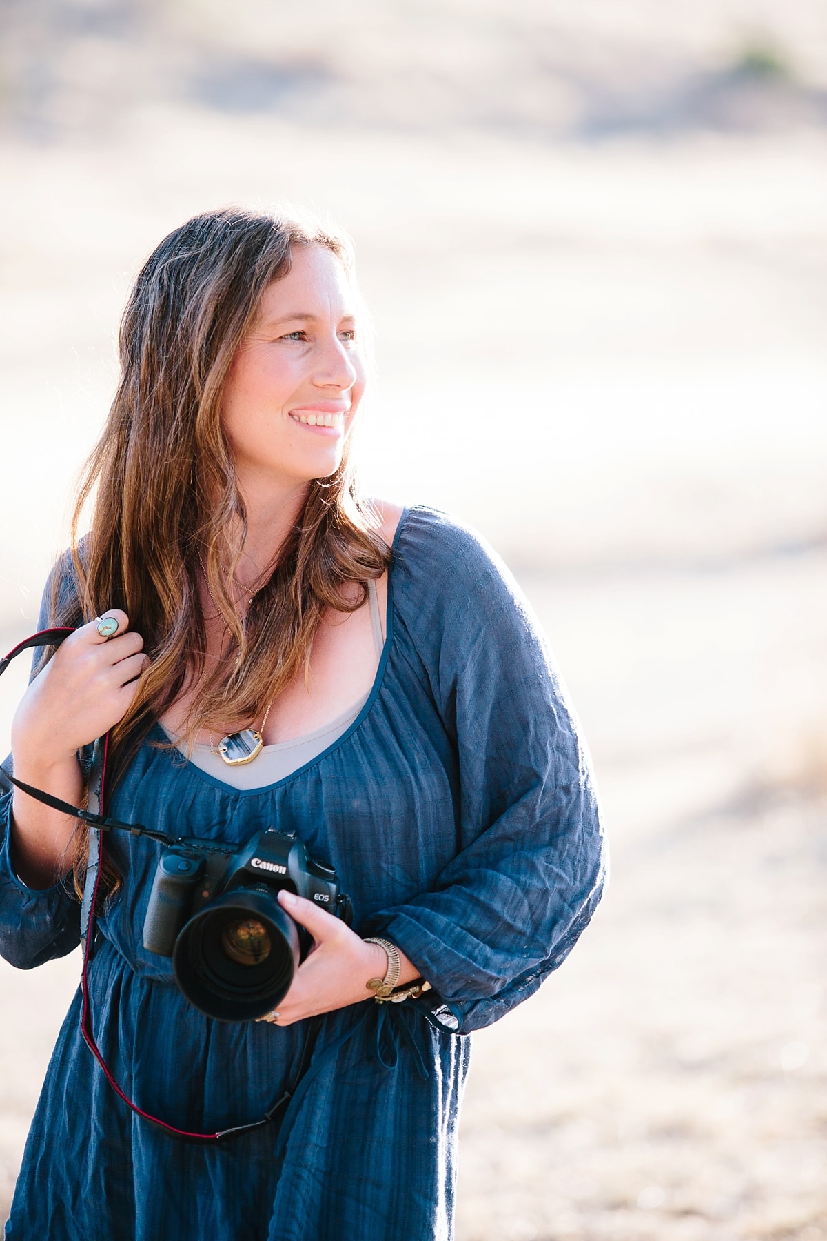 Bend Wedding Photographer holding a camera