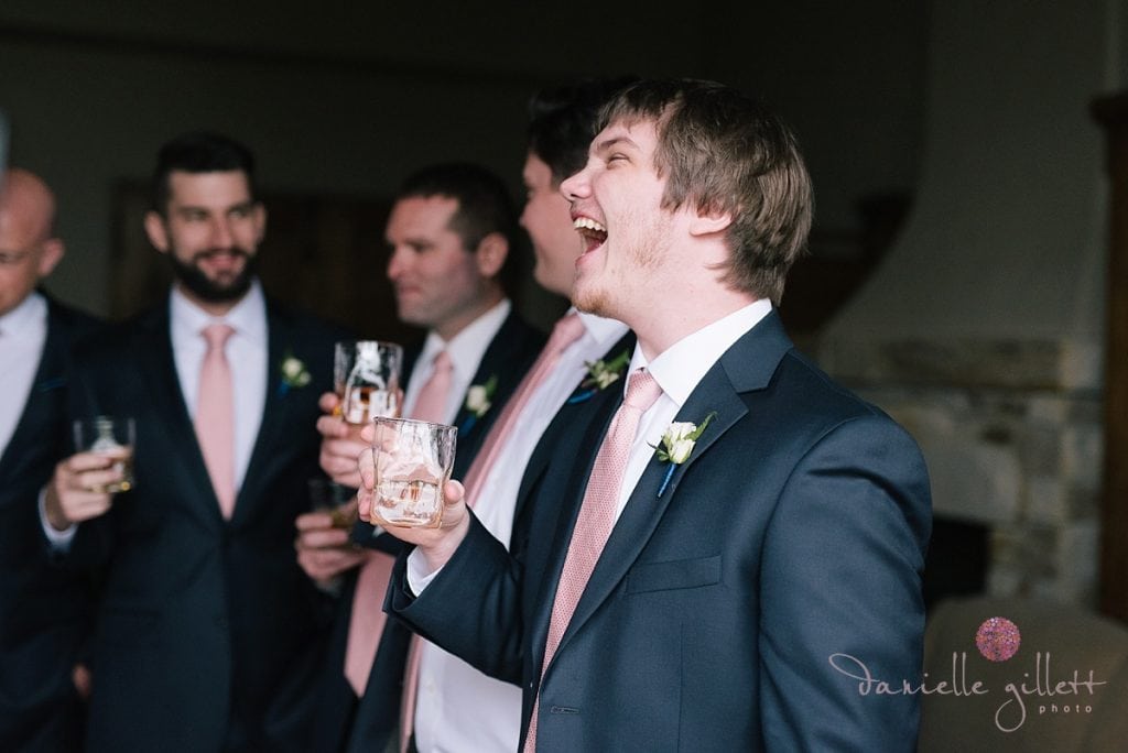 Groomsmen toast during wedding in Carmel Valley